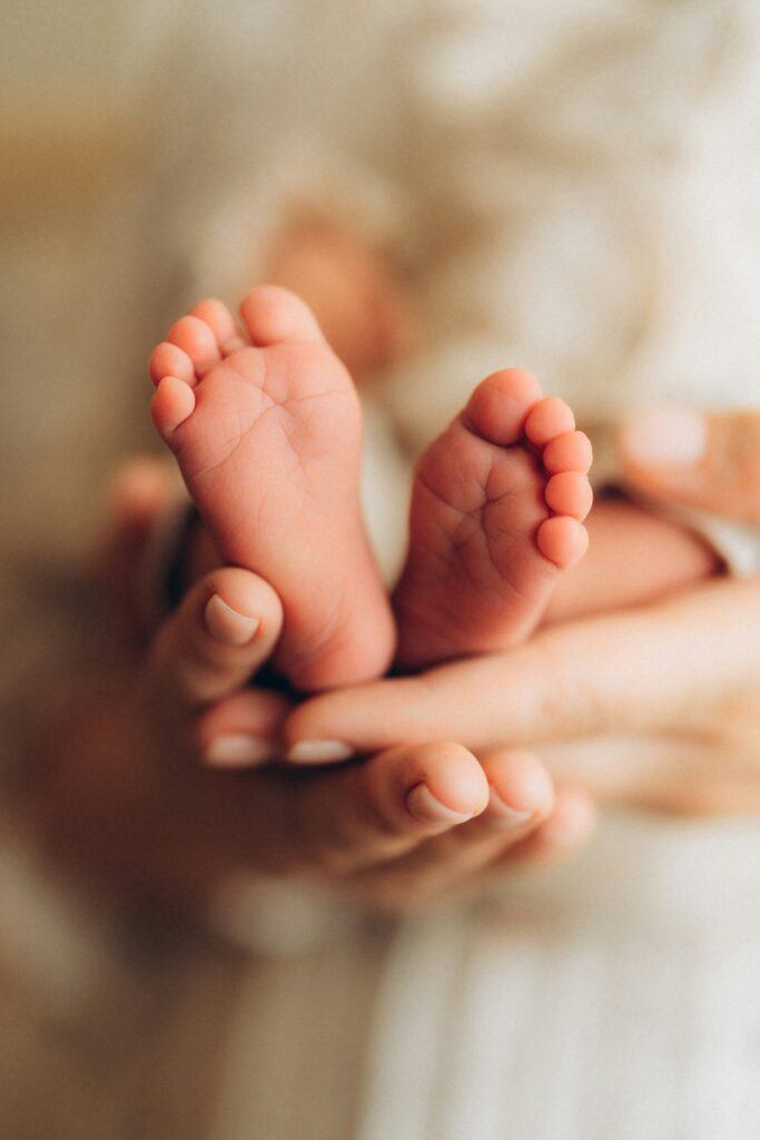 Close up on newborn baby feet.
