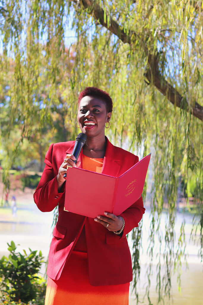 Pauline Appiah-Dwyer speaking into microphone